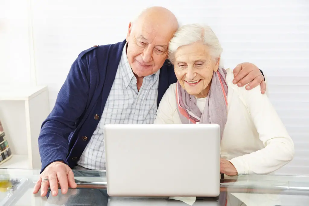 Senior Couple Using Ecommerce In Internet
