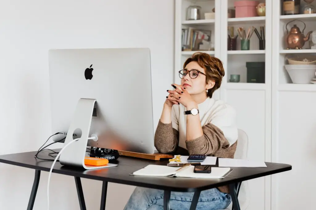 Female Reading Information On Computer