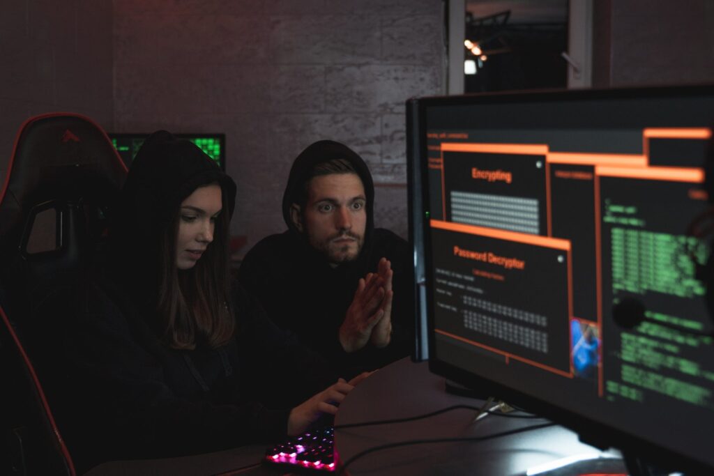 Man And Woman Hacking Computer